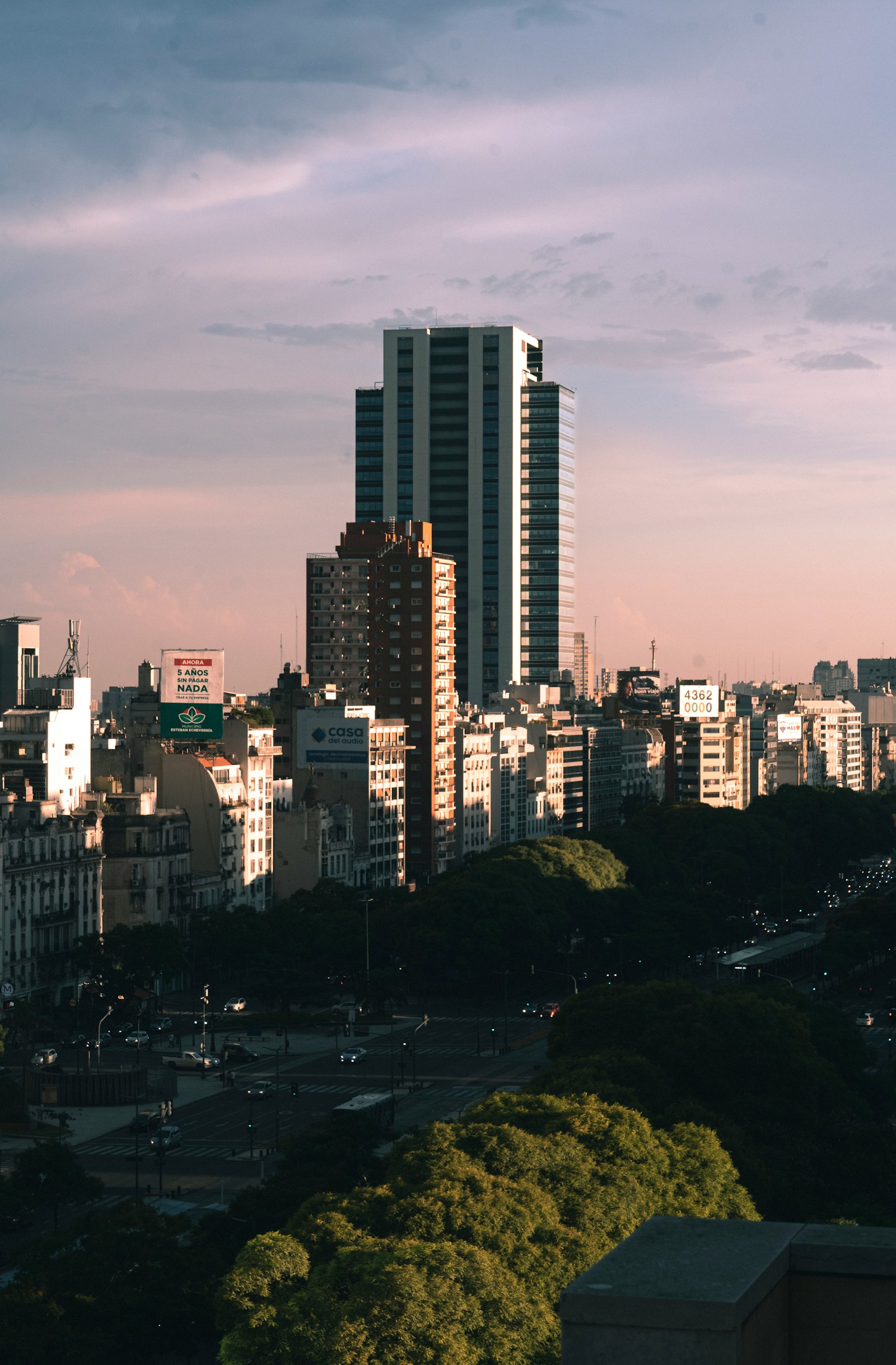 Residential building with glass facade at dusk in Buenos Aires
