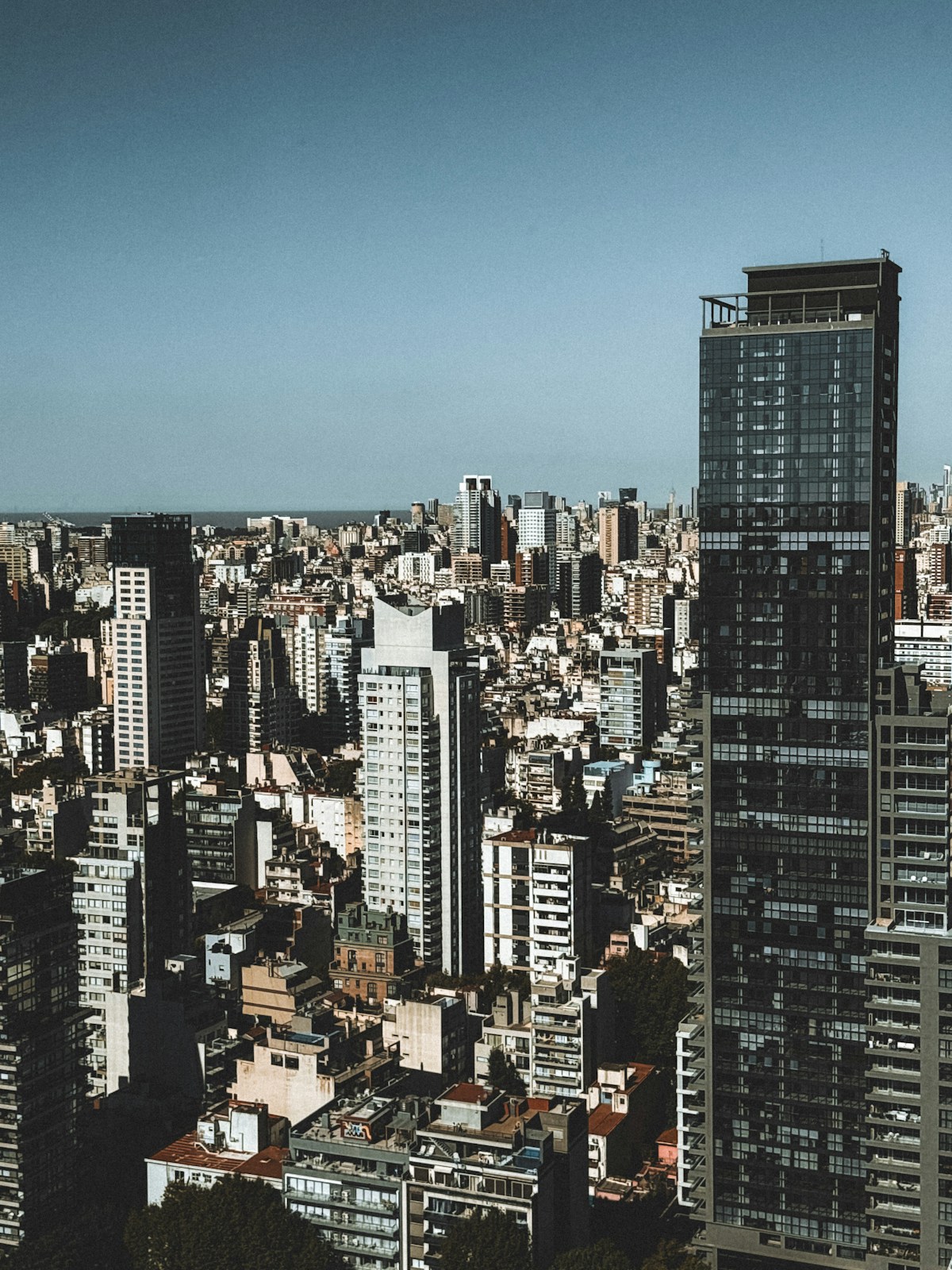 Modern residential tower with glass facade in Puerto Madero